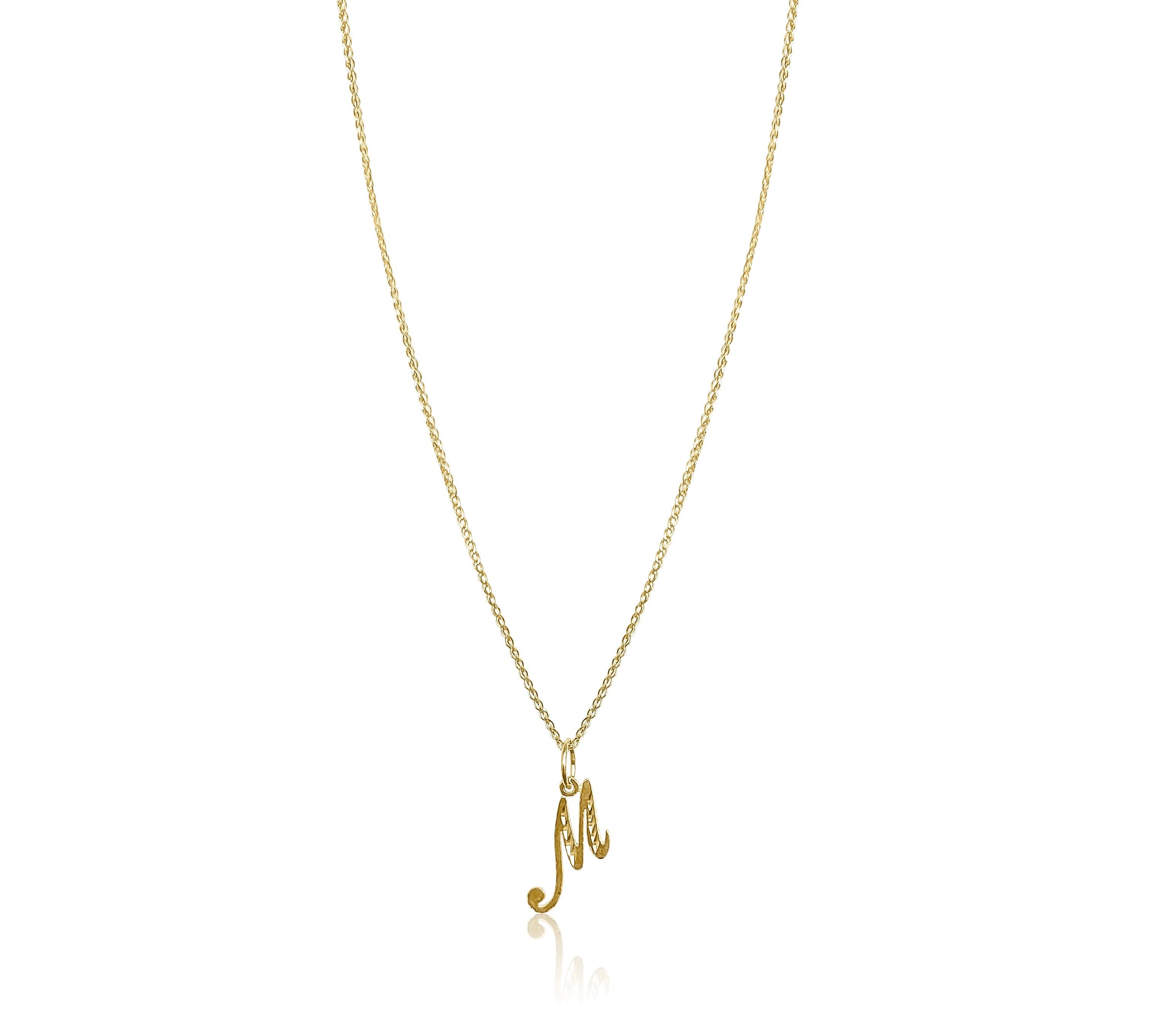 product image of a gold chain with a letter m pendant against a white background