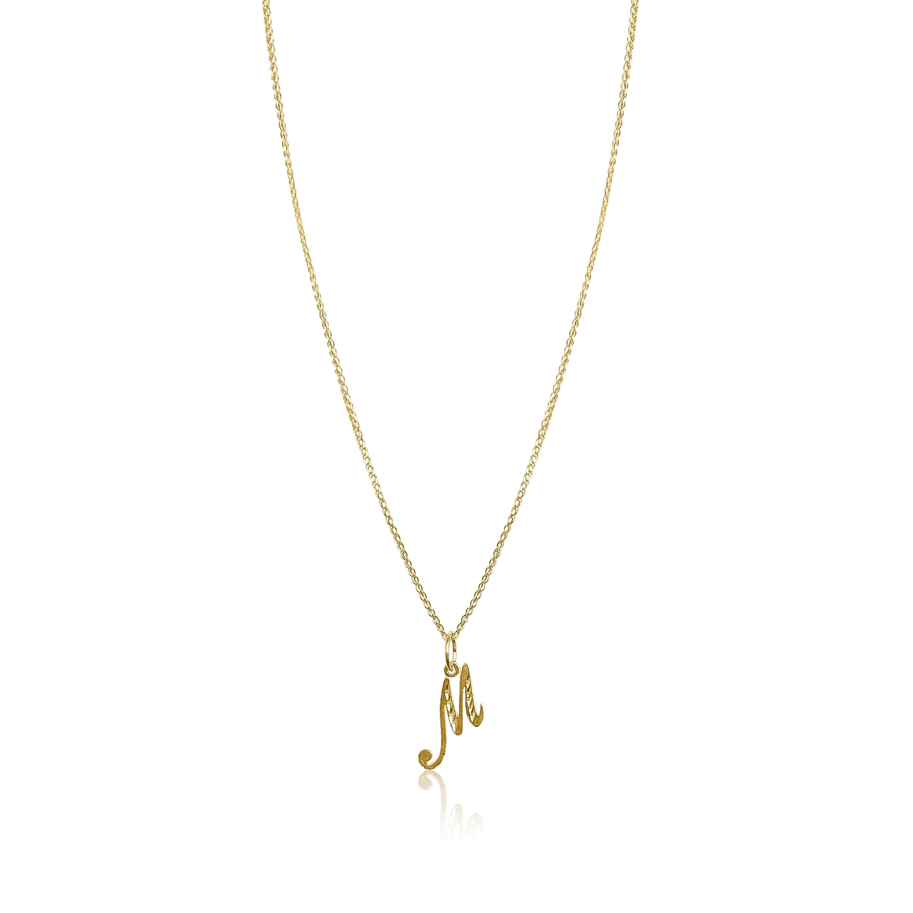 product image of a gold chain with a letter m pendant against a white background